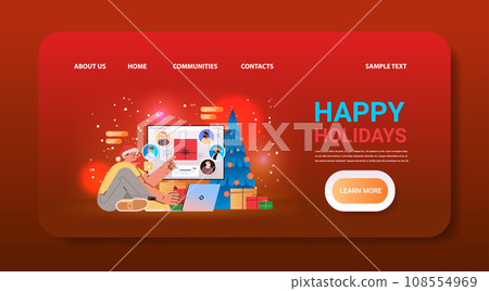 man in santa hat chatting with mix race friends on laptop screen near decorated christmas tree and gift boxes social media communication new year holidays celebration man in santa hat chatting with mix race friends on laptop screen near decorated christmas tree and gift boxes social media communication new year holidays celebration 108554969
