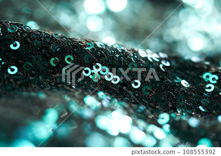 Christmas abstract background made of emerald green sequins. Christmas abstract background made of emerald green sequins. 108555392