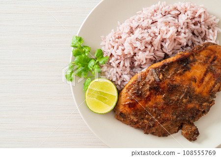 spicy grilled Jamaican jerk chicken with rice 108555769