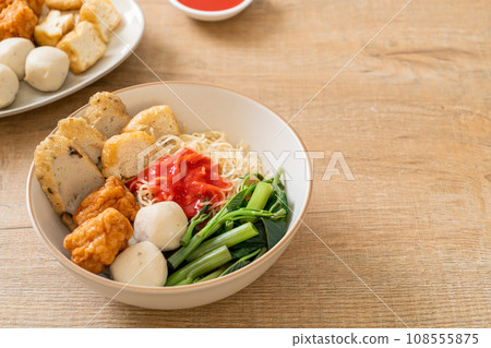 egg noodles with fish balls and shrimp balls in pink sauce, Yen Ta Four or Yen Ta Fo egg noodles with fish balls and shrimp balls in pink sauce, Yen Ta Four or Yen Ta Fo 108555875