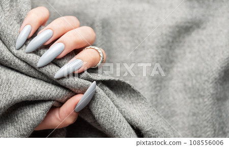 Grey manicure nails with a grey scarf Grey manicure nails with a grey scarf 108556006