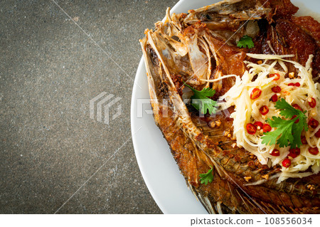 Fried Sea Bass Fish with Fish Sauce and Spicy Salad Fried Sea Bass Fish with Fish Sauce and Spicy Salad 108556034