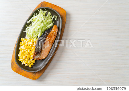 grilled salmon fillet steak on hot plate grilled salmon fillet steak on hot plate 108556079
