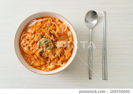 Korean udon ramen noodles with pork in kimchi soup Korean udon ramen noodles with pork in kimchi soup 108556080