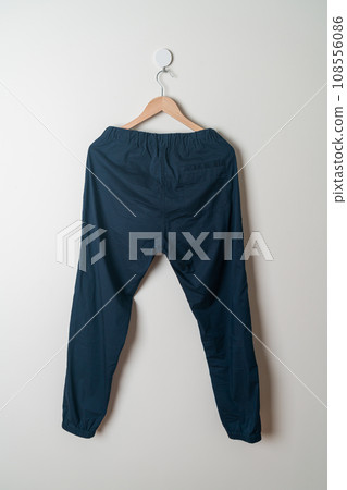 trousers or long pants hanging on wall trousers or long pants hanging on wall 108556086