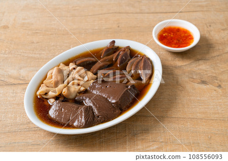 stewed duck offal in brown soup 108556093