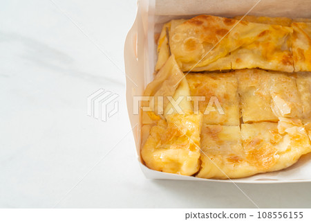 roti with egg and sweetened condensed milk 108556155