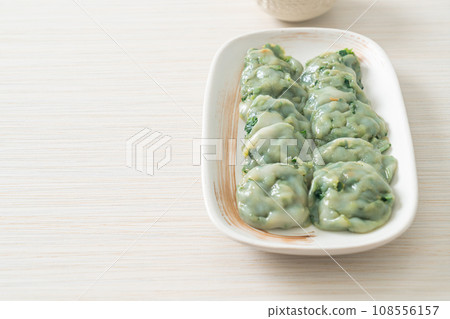 steamed chives dumplings with sauce 108556157