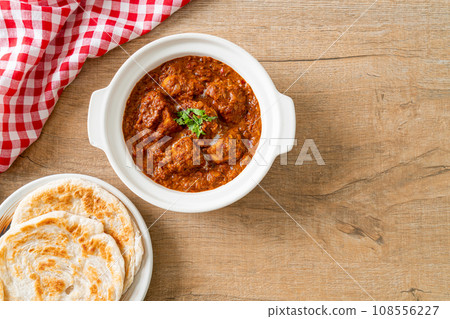 chicken tikka masala spicy curry meat food with roti or naan bread 108556227