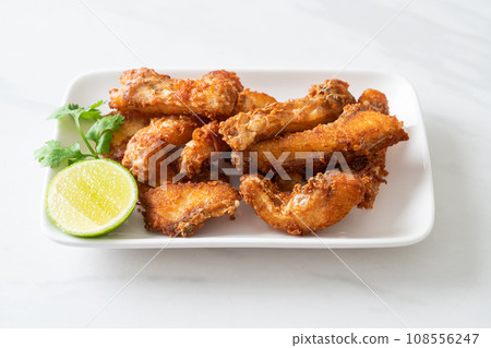 Fried Snapper Belly on white plate 108556247