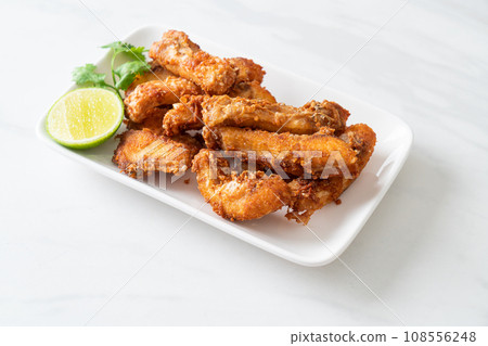 Fried Snapper Belly on white plate 108556248