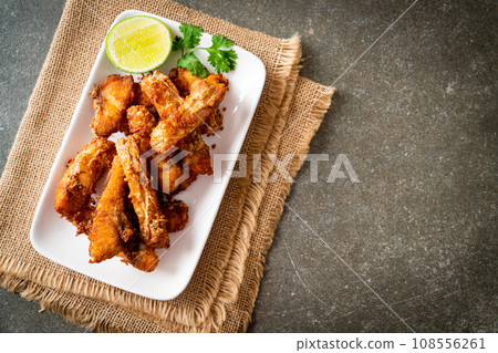 Fried Snapper Belly on white plate 108556261