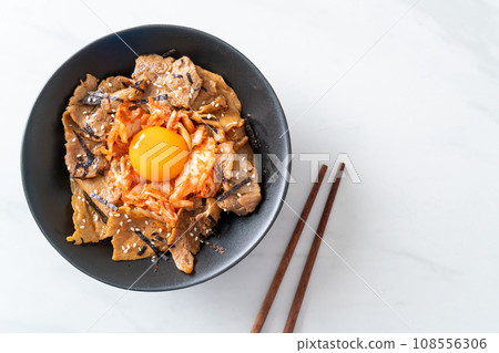 pork bulgogi rice bowl with kimchi and Korean pickled egg 108556306