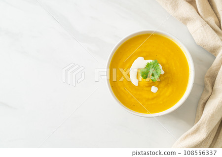 pumpkin soup in white bowl 108556337