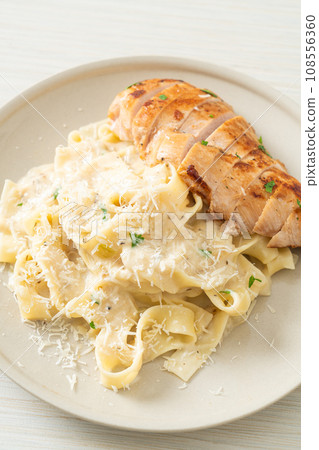 fettucine pasta white creamy sauce with grilled chicken fettucine pasta white creamy sauce with grilled chicken 108556360