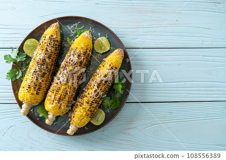 barbecue and grilled corn with cheese and lime 108556389
