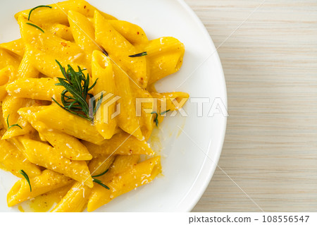 penne pasta with butternut pumpkin creamy sauce 108556547