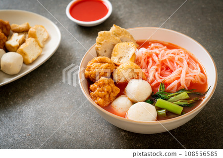 small flat rice noodles with fish balls and shrimp balls in pink soup, Yen Ta Four or Yen Ta Fo 108556585