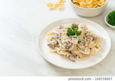 farfalle pasta with mushroom white cream sauce 108556607