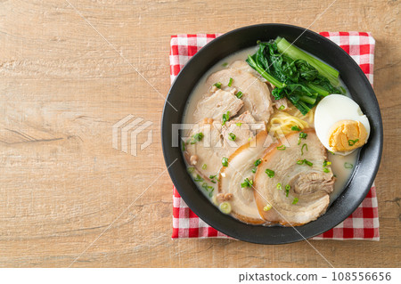 Ramen noodles in pork bone soup with roast pork and egg 108556656