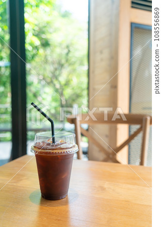 iced black coffee takeaway glass on table in coffee shop cafe restaurant iced black coffee takeaway glass on table in coffee shop cafe restaurant 108556869