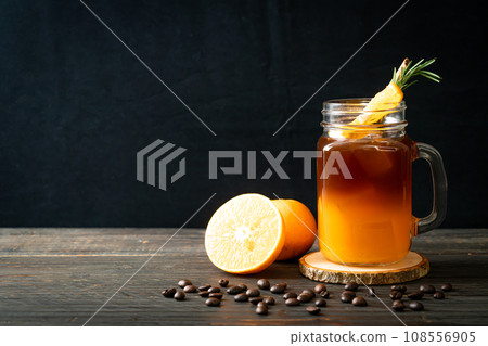 black coffee with orange and lemon juice 108556905
