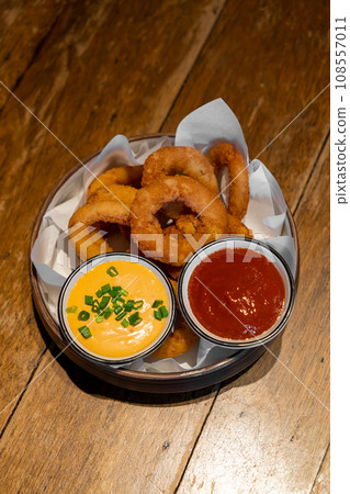 onions ring with ketchup and sauce onions ring with ketchup and sauce 108557011