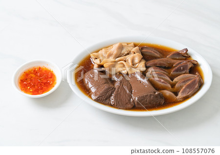 stewed duck offal in brown soup 108557076