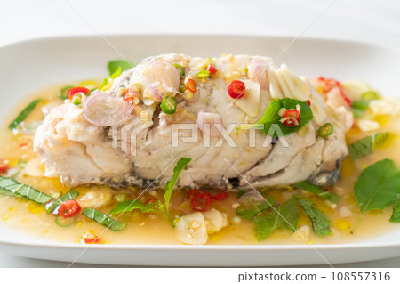 steamed sea bass fish with herbs steamed sea bass fish with herbs 108557316