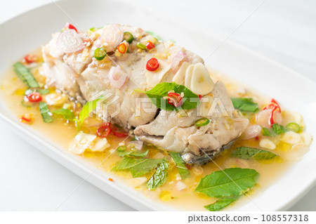 steamed sea bass fish with herbs steamed sea bass fish with herbs 108557318
