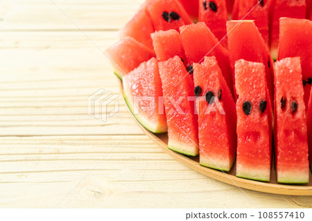 fresh watermelon sliced on plate 108557410