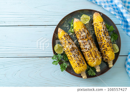 barbecue and grilled corn with cheese and lime barbecue and grilled corn with cheese and lime 108557427