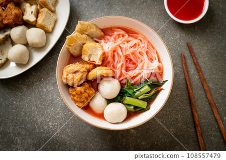 small flat rice noodles with fish balls and shrimp balls in pink soup, Yen Ta Four or Yen Ta Fo small flat rice noodles with fish balls and shrimp balls in pink soup, Yen Ta Four or Yen Ta Fo 108557479