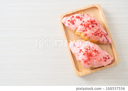 croissant with strawberry chocolate sauce 108557556