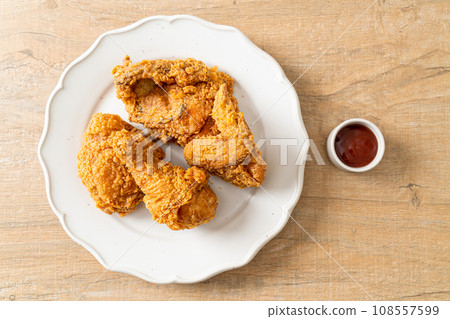 fried chicken with ketchup on plate fried chicken with ketchup on plate 108557599