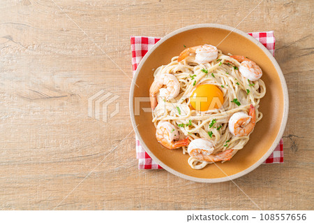 spaghetti white cream sauce with shrimps and egg yolk spaghetti white cream sauce with shrimps and egg yolk 108557656