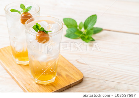 iced plum juice with soda and peppermint iced plum juice with soda and peppermint 108557697