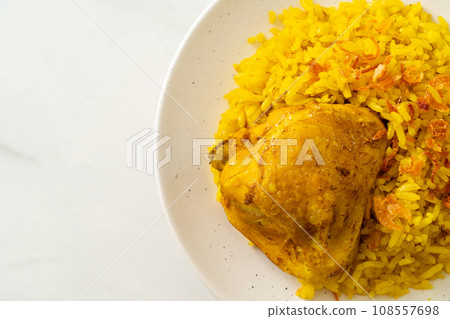 Chicken Biryani or Curried rice and chicken - Thai-Muslim version of Indian biryani, with fragrant yellow rice and chicken Chicken Biryani or Curried rice and chicken - Thai-Muslim version of Indian biryani, with fragrant yellow rice and chicken 108557698