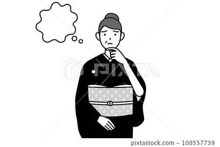 A senior woman in a kimono, scratching her face and thinking, at a New Year's shrine visit, a wedding, etc. 108557739