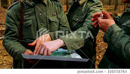 World War II German wehrmacht Soldier officer Commander Soldiers Of World War II Briefs, Showing Direction Of A Attack On Map 108558763