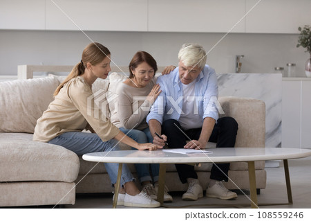 Consultant visiting senior couple at home, explaining agreement Consultant visiting senior couple at home, explaining agreement 108559246