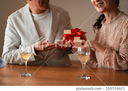 Senior couple celebrating anniversary Senior couple celebrating anniversary 108559921