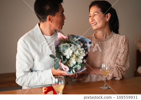 Senior couple celebrating anniversary Senior couple celebrating anniversary 108559931