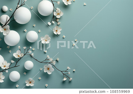 Flat lay delicate dusty blue background with delicate white flowers on a branch and white balls with copy space Flat lay delicate dusty blue background with delicate white flowers on a branch and white balls with copy space 108559969