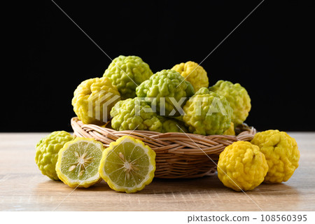 Kaffir lime fruit in basket with black background 108560395