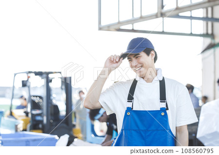 A young fisherman working at a fishing port A young fisherman working at a fishing port 108560795