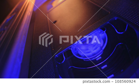 VHS mechanism inside, cassette player, magnetic head. Rotation reel, video tape 108560924