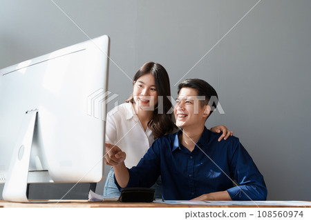 Startup family business, husband and wife discussing financial affairs, investing, making profit, tax deduction from trading using computer and investment budget paperwork working. Startup family business, husband and wife discussing financial affairs, investing, making profit, tax deduction from trading using computer and investment budget paperwork working. 108560974