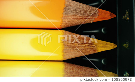 Crayons in yellow gradient row. Extreme macro shot. Pencils graphite set. 108560978