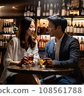 Man and woman working in a bar 108561788